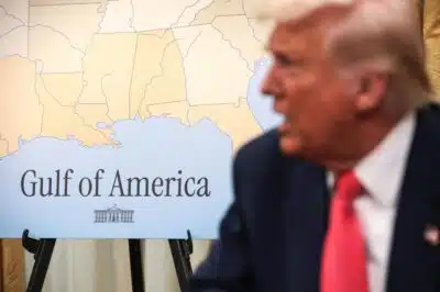 WASHINGTON, DC - MARCH 06: A map of the Gulf of America is seen as U.S. President Donald Trump speaks before signing executive orders in the Oval Office of the White House on March 06, 2025 in Washington, DC. President Trump signing a series of executive orders, including, lifting 25% tariffs for all goods compliant under USMCA trade agreement, terminating the security clearances of those who work at the law firm Perkins Coie, combating drug trafficking at the northern border and announced a $20 billion investment by shipping giant CMA CGM for U.S. infrastructure and jobs.   Alex Wong/Getty Images/AFP (Photo by ALEX WONG / GETTY IMAGES NORTH AMERICA / Getty Images via AFP)