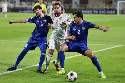 Uzbekistan's defender #3 Khojiakbar Alijonov and defender #2 Abdukodir Khusanov vie for the ball against UAE's forward #7 Ali Saleh during the 2026 FIFA World Cup Asian Qualifier football match between the United Arab Emirates and Uzbekistan at Al-Nahyan Stadium in Abu Dhabi on June 5, 2025. (Photo by Fadel SENNA / AFP)