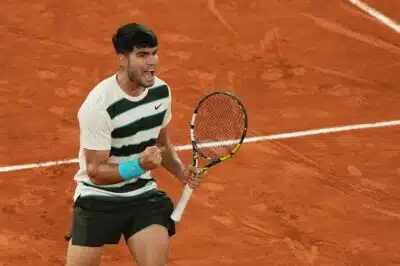 Spain's Carlos Alcaraz reacts to a point against as he plays against Italy's Lorenzo Musetti during their men's singles semi-final match on day 13 of the French Open tennis tournament on Court Philippe-Chatrier at the Roland-Garros Complex in Paris on June 6, 2025. (Photo by Dimitar DILKOFF / AFP)