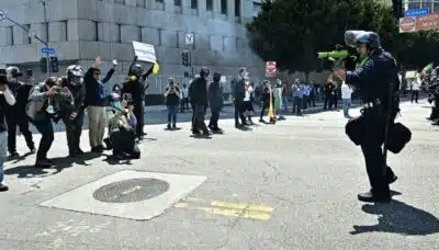 Law enforcement clashes with demonstrators outside the Metropolitan Detention Center, MDC, in downtown Los Angeles, California on June 8, 2025. US President Donald Trump deployed 2,000 troops on June 7 to handle escalating protests against immigration enforcement raids in the Los Angeles area, a move the state's governor termed 