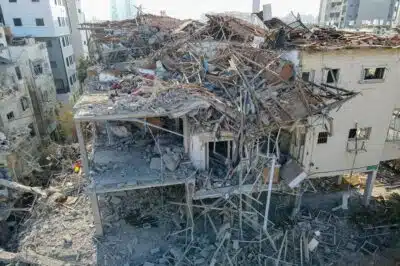 This aerial picture shows damaged buildings at a site hit by a missile fired from Iran in the Israeli city of Ramat Gan near Tel Aviv on June 14, 2025. Iran struck Israel early June 14, with barrages of missiles after a massive onslaught targeted the Islamic republic's nuclear and military facilities, and killed several top generals. (Photo by Jack GUEZ / AFP)