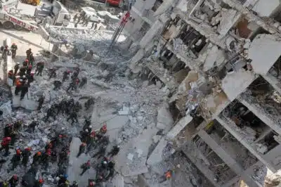 Israeli rescuers search through the rubble of a heavily damaged building, following an overnight Iranian missile strike in Bat Yam on June 15, 2025. Israeli Prime Minister Benjamin Netanyahu said that Iran would pay 