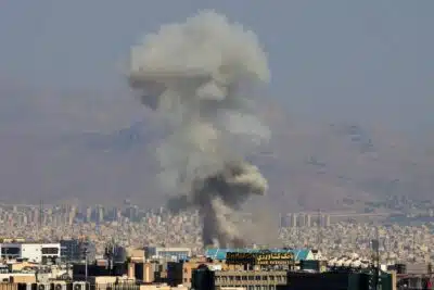 Smoke billows following an explosion in central Tehran on June 15, 2025. Iranian media said an Israeli strike hit the Tehran police headquarters in the city centre on June 15, as the two foes exchanged fire for a third day. (Photo by Atta KENARE / AFP)