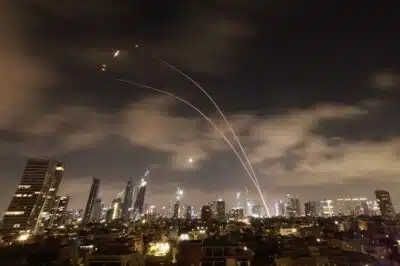 Israeli air defence systems are activated to intercept Iranian missiles over the Israeli city of Tel Aviv early on June 18, 2025. Israel and Iran exchanged fire again on June 17, the fifth day of strikes in their most intense confrontation in history, fuelling fears of a drawn-out conflict that could engulf the Middle East. (Photo by Menahem Kahana / AFP)
