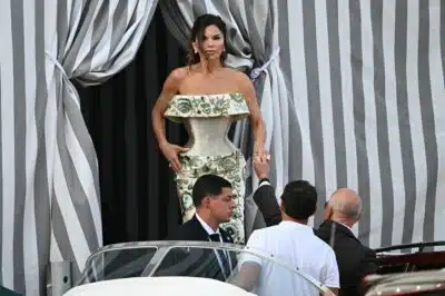 Amazon founder Jeff Bezos and Lauren Sanchez get on a taxi boat at the Aman Hotel in Venice on June 26, 2026. Celebrities in superyachts sail into Venice this week for the three-day wedding party of Amazon tycoon Jeff Bezos and Lauren Sanchez, despite irate locals who say the UNESCO city is no billionaire's playground. The tech magnate and journalist have reportedly invited about 200 guests to their multi-million dollar nuptials in the Italian city, which are expected to kick off on June 26 and end Saturday with a ceremony at a secret location. (Photo by Stefano Rellandini / AFP)
