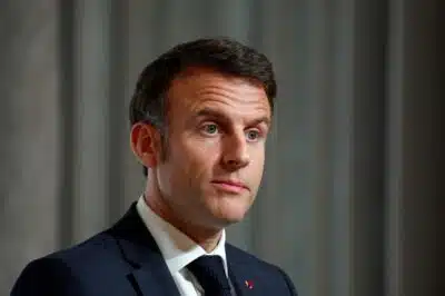 French President Emmanuel Macron looks on during a press conference at the end of the international conference aimed at strengthening Western support for Ukraine, at the Elysee presidential palace in Paris, on February 26, 2024. The meeting at the Elysee Palace will be a chance for participants to 