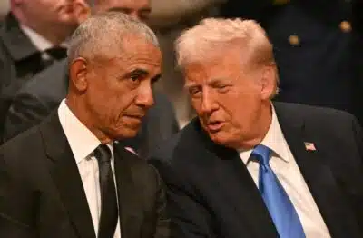 Former US President Barack Obama speaks with President-elect Donald Trump before the State Funeral Service for former US President Jimmy Carter at the Washington National Cathedral in Washington, DC, on January 9, 2025. (Photo by ROBERTO SCHMIDT / AFP)