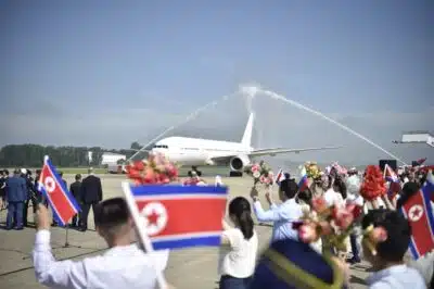 Russia's Nordwind Airlines' Boeing 777 is welcomed after landing at Pyongyang International Airport in Pyongyang on July 28, 2025. A Russian passenger jet landed at North Korea's main airport on July 28, a flight tracking site showed, completing the first commercial leg in decades between capitals of the allied countries. (Photo by KIM Won Jin / AFP)
