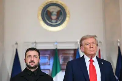 US President Donald Trump and Ukrainian President Volodymyr Zelensky stand for a family photo with European leaders in the Cross Hall of the White House in Washington, DC, on August 18, 2025. European leaders join Ukrainian President Volodymyr Zelensky in talks with US President Donald Trump on August 18, as they try to find a way to end Russia's offensive.  The leaders heading to Washington on Monday to appear alongside Zelensky call themselves the 
